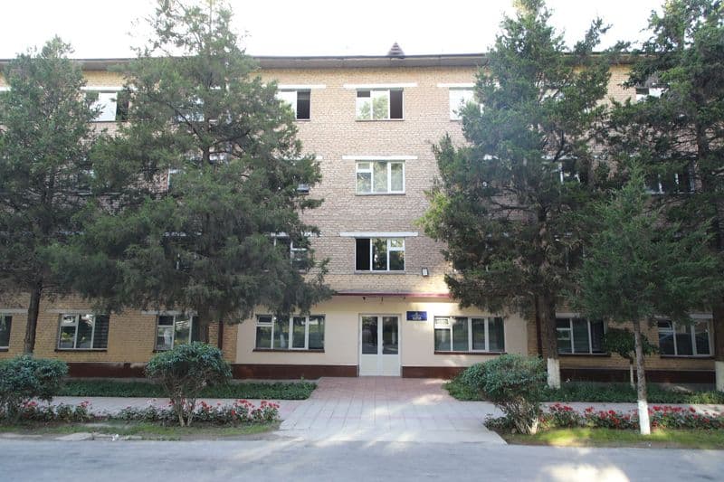 A student residence among the trees of the campus